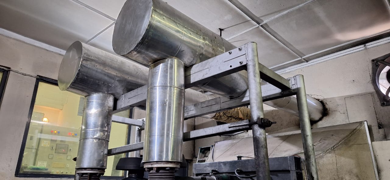 Stainless-steel jacketed exhaust pipework above a Maldives resort genset